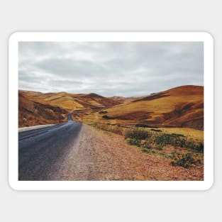 Empty Road in Dry Hilly Countryside Sticker